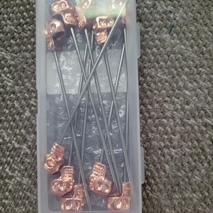 Rose gold skull cocktail picks